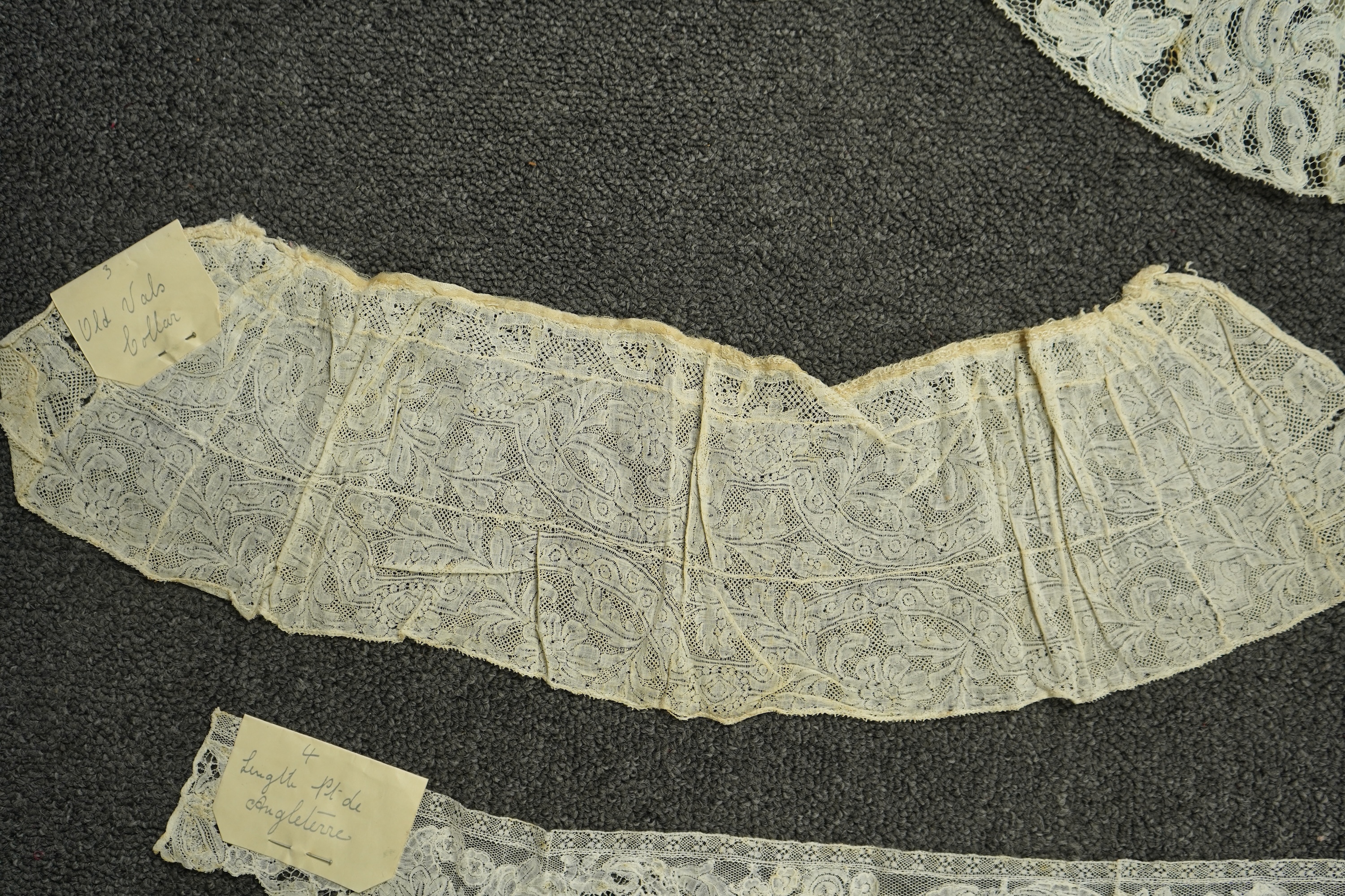 Various lengths of 18th and 19th century lace trimming and two needle run bonnets. Including a collar made from two rows of 18th century Valenciennes lace, a length Valenciennes lace, a shorter length of Pointe de Anglet